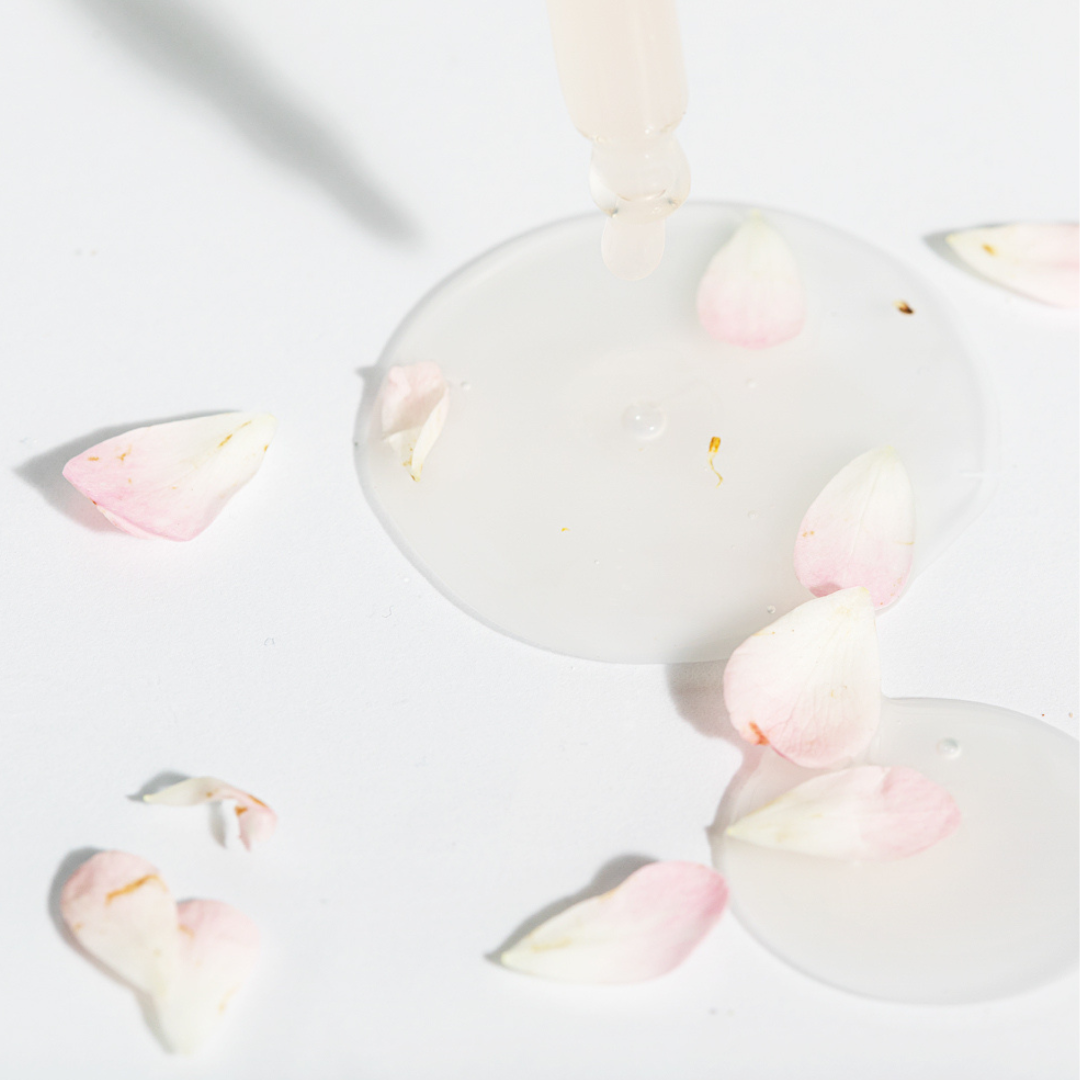 Face serum with rose petals
