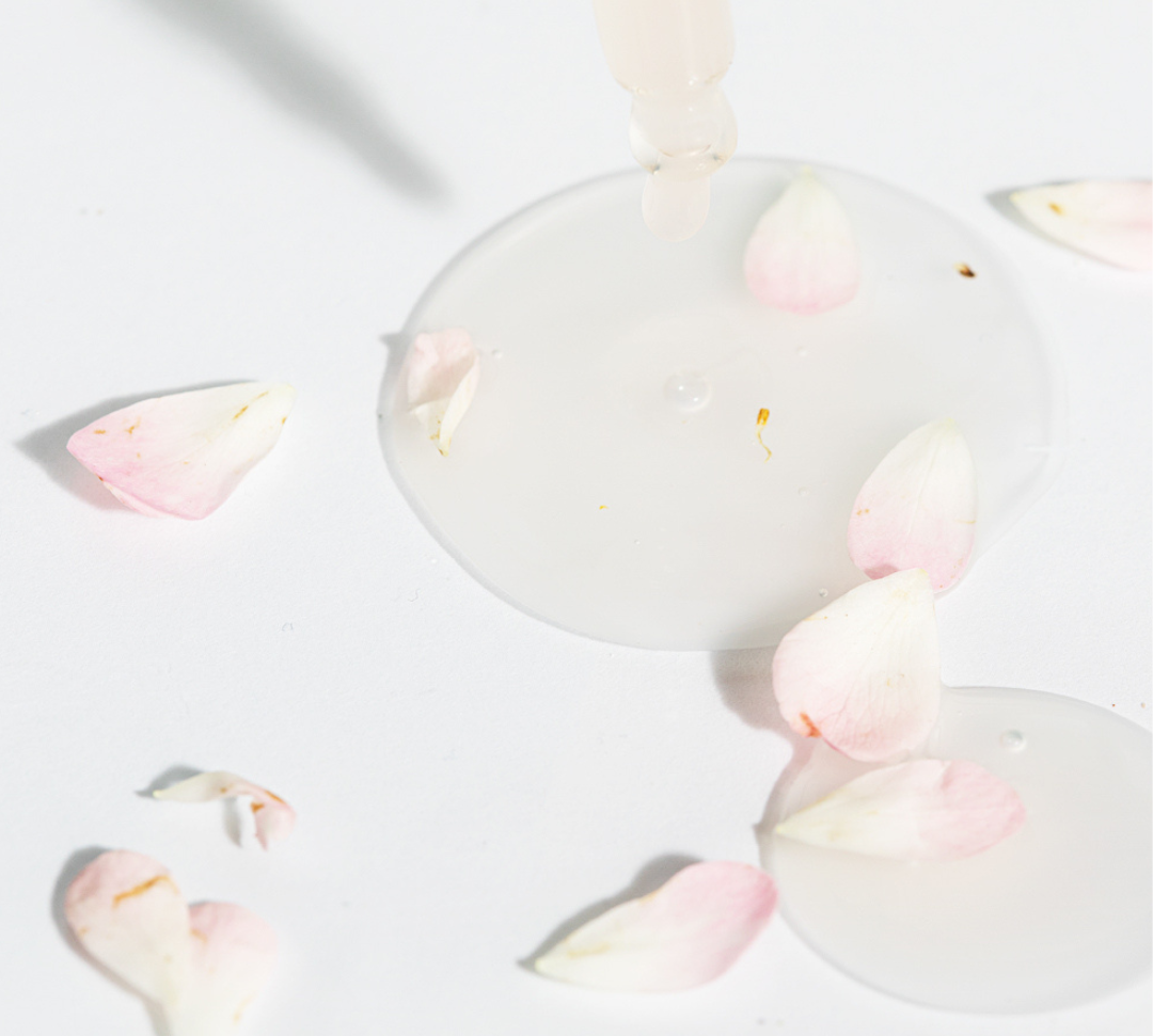 Face serum with rose petals