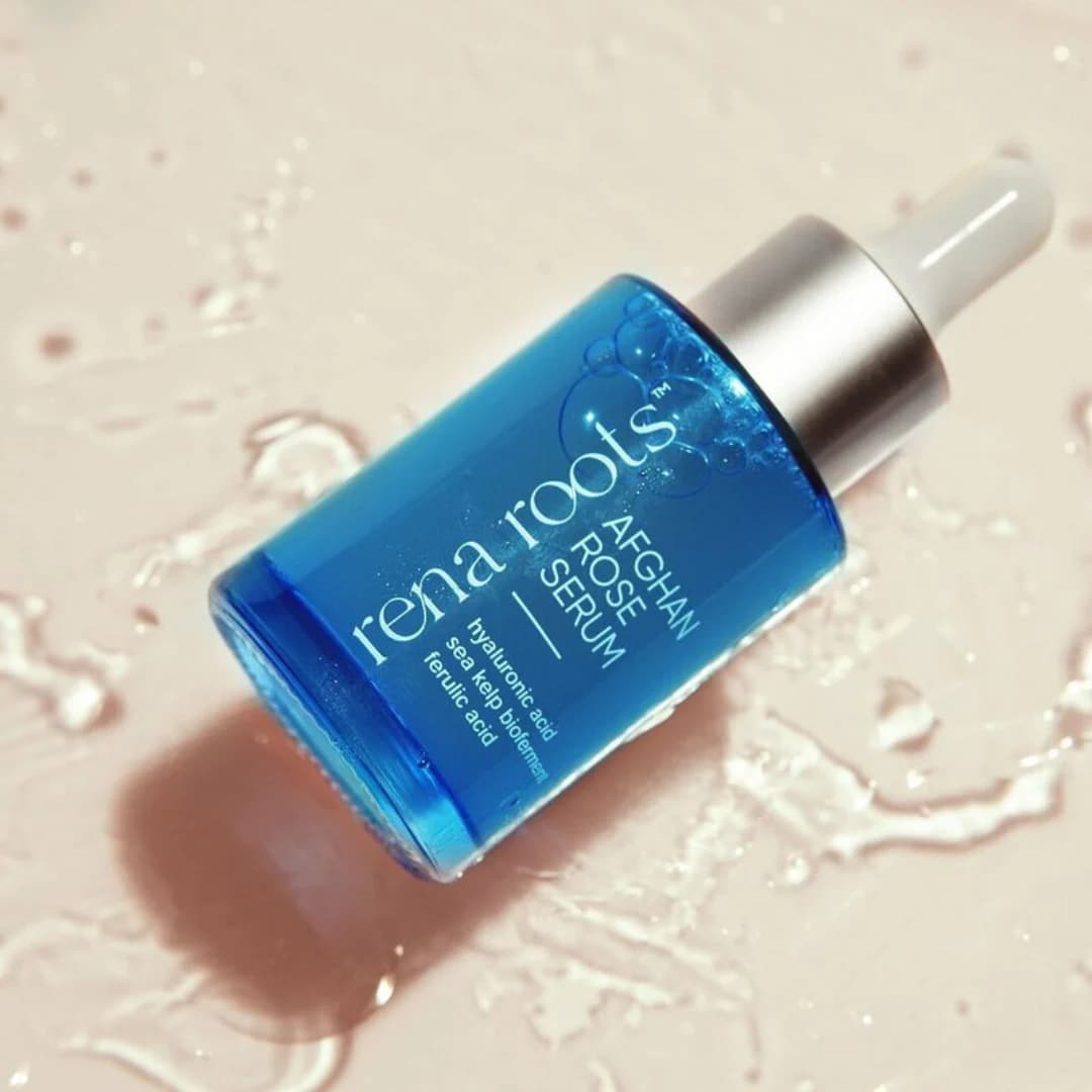 Blue Afghan Rose Serum dropper laying in water