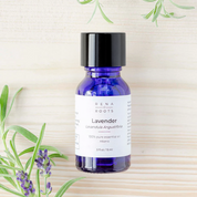 Pure Lavender Essential Oil bottle with lavender sprigs – organic, calming aromatherapy oil for sleep and stress relief